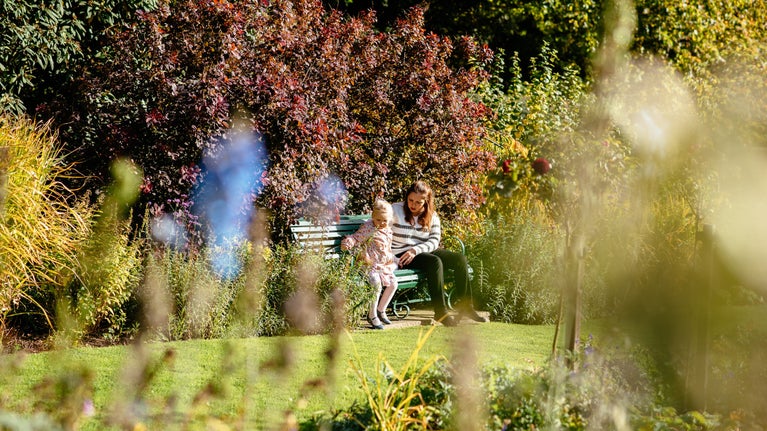 Visitors relaxing in the garden at Ormesby Hall, the mid-c18th Palladian house, Yorkshire